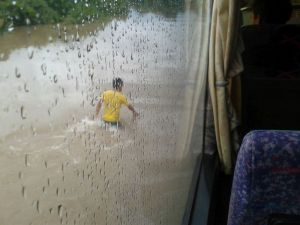 Bus driving through flooded roads